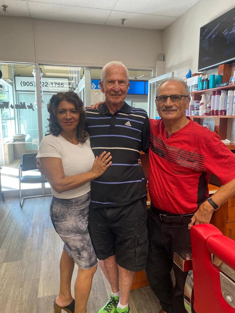 Three people posing together inside a retail store with shelves of products in the background